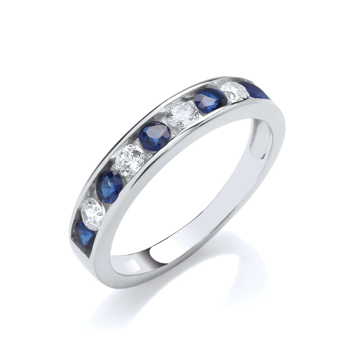Sapphire Blue CZ Eternity Ring in silver with sapphire blue and clear cubic zirconia stones, showcasing channel set design.
