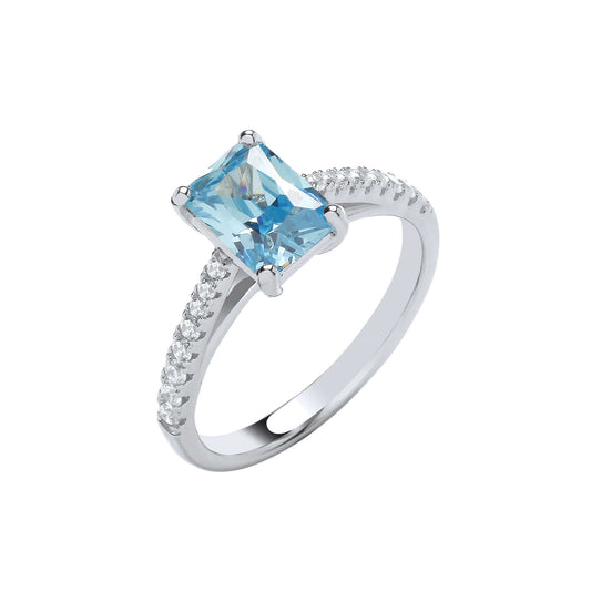 Silver Blue Stone Solitaire ring with emerald cut cubic zirconia and brilliant cut shoulder stones.