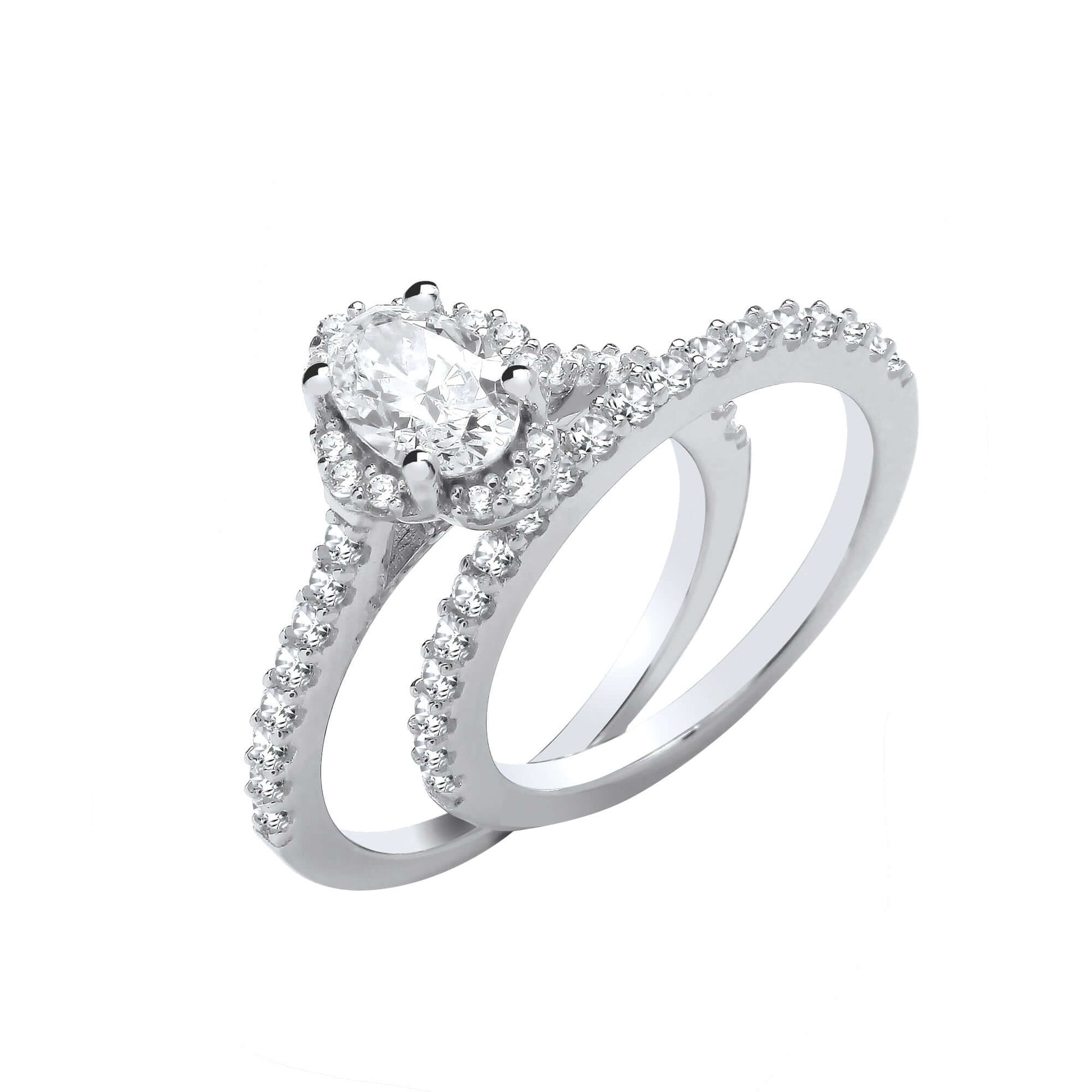 Silver Bridal Set with oval cut cubic zirconia stones, featuring a solid silver band adorned with brilliant cut zirconias.