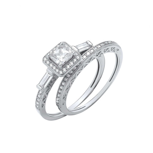 Silver Bridal Set with princess cut cubic zirconia, halo setting, and baguette shoulders featuring a matching glittering band.